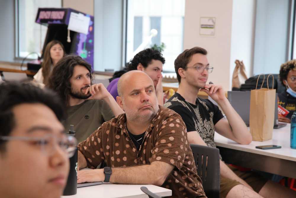 Attendees listening attentively during the workshop #1